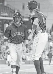  ?? Eric Christian Smith / Getty Images ?? The hot hitting of Colby Rasmus continued in dramatic fashion with a game-tying homer in the ninth Sunday that also brought home Carlos Correa.