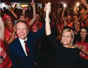  ??  ?? Malcolm Turnbull in Sydney yesterday (left); and Bill Shorten celebratin­g with Susan Lamb in Longman on Saturday night. Pictures: JENNY EVANS, AAP