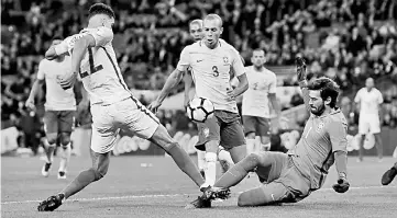  ??  ?? Brazil’s Alisson and Miranda (right) in action with England’s Dominic Solanke during the internatio­nal friendly football match at Wembley Stadium in London. — Reuters photo