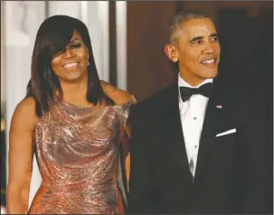  ?? The Associated Press ?? STORYTELLE­RS: President Barack Obama and first lady Michelle Obama wait to greet Italian Prime Minister Matteo Renzi and his wife Agnese Landini for a State Dinner on Oct. 8, 2016 at the White House in Washington. Netflix says that it has reached a...