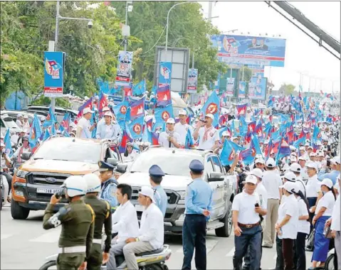  ?? HENG CHIVOAN ?? Supporters of the Cambodian People’s Party (CPP) take part in a rally to kick off the campaign season on July 7.