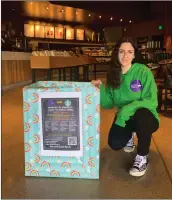  ?? Courtesy photo ?? Rachel Rosenberg shows off one of the many “Bundles of Kindness” donation bins she placed in local Starbucks.