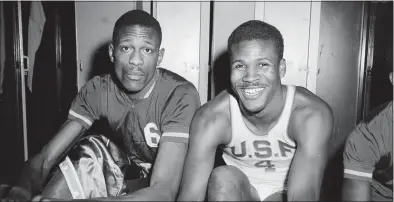  ?? Robert Houston / Associated Press ?? K.C. Jones, captain of the University of San Francisco Dons, right, is shown with teammate Bill Russell in 1956.