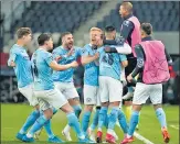  ??  ?? Man City players celebrate their winner on Wednesday.