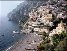  ?? Rick Steves’ Europe ?? Specializi­ng in scenery and sand, Positano scrambles down a cliff halfway between Sorrento and Amalfi.