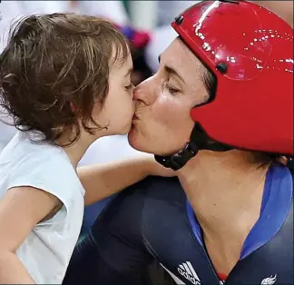  ??  ?? Pucker up! Cycling champion Sarah Storey with daughter Louisa, 3, after the race