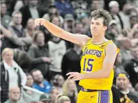  ?? AP Photo/morry Gash ?? Los Angeles Lakers’ Austin Reaves reacts after making a three-pointer during the second overtime of an NBA basketball game against the Milwaukee Bucks Tuesday, March 26, 2024, in Milwaukee. The Lakers won 128-124 in double overtime.