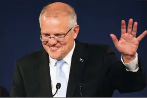  ?? AP/RICK RYCROFT ?? “I have always believed in miracles,” Australian Prime Minister Scott Morrison said today after his opponent conceded defeat in the federal election in Sydney.