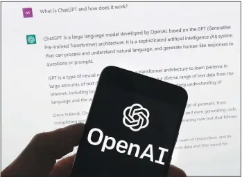  ?? (File Photo/AP/Michael Dwyer) ?? The OpenAI logo is seen on a mobile phone in front of a computer screen, which displays output from ChatGPT, on March 21 in Boston.