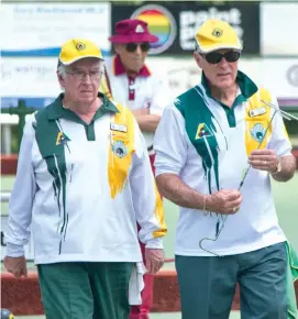  ??  ?? Left: Warragul bowlers Ian Belling (left) and David Alderman are deep in discussion during a tight contest against Traralgon on Saturday. Their rink won 20/19 to help secure overall victory.