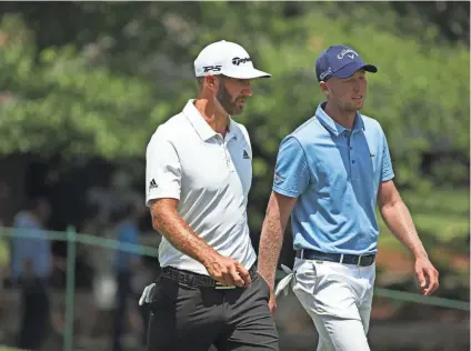 ??  ?? Leader Dustin Johnson, left, and reigning champion Daniel Berger during the annual FedEx St. Jude Classic at TPC Southwind on Friday. YALONDA M. JAMES/THE COMMERCIAL APPEAL