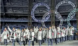  ??  ?? Some small steps between the two Koreas hold promise of a dialogue beginning on the eve of the Winter Olympics: (FILES) This file photo taken on February 10, 2006 shows South Korean and North Korean athletes marching together during the opening...