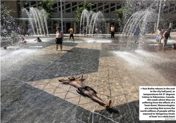  ?? Jason Franson ?? > Kais Bothe relaxes in the cool in the city hall pool, as temperatur­es hit 37 degrees Celsius in Edmonton, Canada, this week where they are suffering from the effects of a ‘heat dome’. Meteorolog­ists are warning that across the world millions of people will be exposed to ‘dangerous levels of heat’ on a daily basis