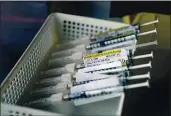  ?? JAE C. HONG — THE ASSOCIATED PRESS FILE ?? Syringes containing the Pfizer-BioNTech COVID-19 vaccine sit in a tray in a vaccinatio­n room at St. Joseph Hospital in Orange on Thursday.