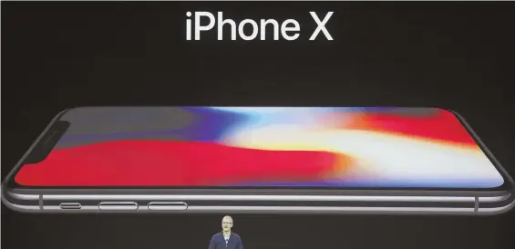  ?? AP FILE PHOTO ?? FOR OPENERS: Apple CEO Tim Cook introduces the new iPhone X at the Steve Jobs Theater on the company’s campus in Cupertino, Calif., last month.