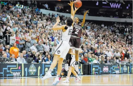  ?? Tony Gutierrez ?? The Associated Press file Morgan William (2), who has been invited to the Aces’ camp, sinks a buzzer-beating shot to give Mississipp­i State a 66-64 upset victory over Connecticu­t in the 2017 Final Four.