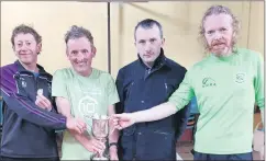  ?? ?? Mooreabbey Milers AC county O50 champions, accepting their trophy from County chairman, Owen Fanning.