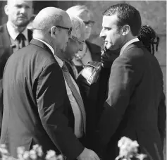  ??  ?? Macron (right) speaks with French Defence Minister Jean-Yves Le Drian (left), French National Assembly president Claude Bartolone and Macron’s press relations manager Sibeth Ndiaye as they leave Saint-Jean-du-Baly church after the funeral ceremony of...