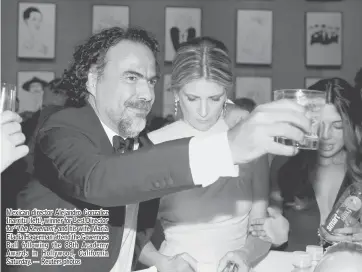  ??  ?? Mexican director Alejandro Gonzalez Inarritu (left), winner for Best Director for ‘ TheRevenan­t’, and his wife Maria Eladia Hagerman attend the Governors Ball following the 88th Academy Awards in Hollywood, California Saturday. — Reuters photos