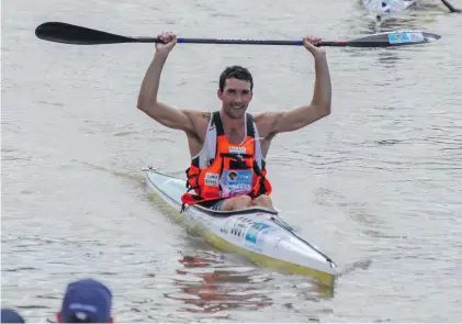  ?? Picture: Gallo Images ?? NINTH TITLE. A delighted Andy Birkett crosses the finish line to win the Dusi Canoe Marathon from Pietermari­tzburg to Durban on Saturday.