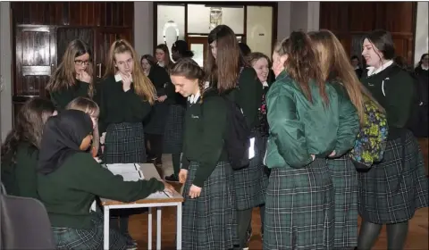  ??  ?? Students waiting for their ballot papers in the Mock Election in Dun Lughaidh school.