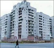  ??  ?? A BUILDING in Avdiivka bears shell damage. The hospital is another war casualty, having taken 20 direct hits, destroying four of the seven buildings.