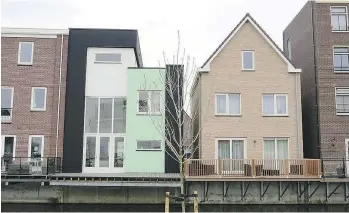  ??  ?? On a plot of government-owned land in Almere Oosterwold in the Netherland­s, individual­s are allowed to design and build their homes as they please. Some might not find it pleasing to the eye, but it attracts attention.