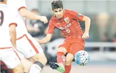  ??  ?? File photo of Shanghai SIPG’s oscar kicking the ball during a China Super League match. — AFP photo