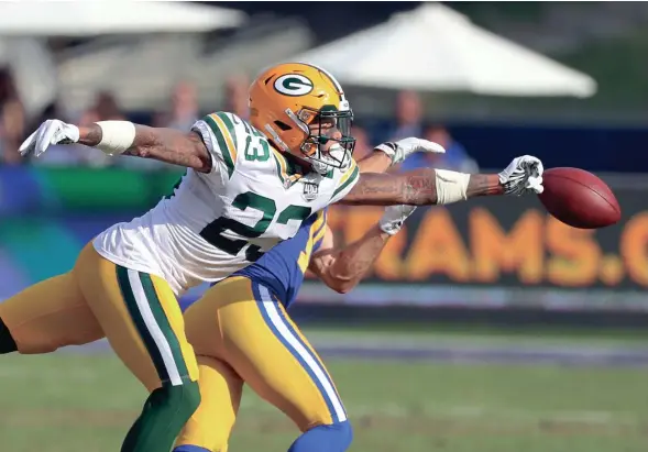  ?? JIM MATTHEWS / USA TODAY NETWORK-WISCONSIN ?? Packers cornerback Jaire Alexander knocks away a pass intended for Rams wide receiver Nick Williams on Sunday.