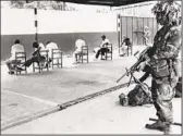  ?? DEPARTMENT OF DEFENSE VIA AP ?? Specialist Jesus Martinez guards Panama Defense Force members at a prison in Panama City in 1989.