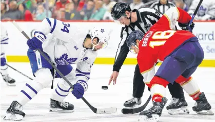  ?? ?? Toronto Maple Leafs centre Auston Matthews and Florida Panthers centre Aleksander Barkov face off during the first period of Tuesday’s NHL game at Amerant Bank Arena in Florida. SAM NAVARRO ■ USA TODAY SPORTS