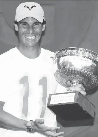  ?? CAMERON SPENCER/GETTY IMAGES ?? Spanish star Rafael Nadal captured his 11th French Open title Sunday in Paris, the 17th Grand Slam title of his storied career, with a 6-4, 6-3, 6-2 sweep of Austria’s Dominic Thiem.