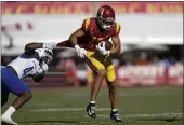  ?? ASHLEY LANDIS — THE ASSOCIATED PRESS ?? USC wide receiver Drake London (15) is tackled by San Jose State linebacker Jordan Cobbs Saturday in Los Angeles.