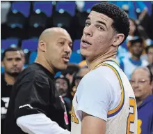  ?? ASSOCIATED PRESS FILE PHOTO ?? Lonzo Ball, right, walks away after hugging his father, LaVar, following UCLA’s NCAA college basketball game against Washington State in Los Angeles in March 2017.