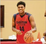  ?? DAVID JABLONSKI / STAFF ?? Dayton’s Jordan Pierce smiles as he warms up on Sept. 21 at the Cronin Center. The Flyers are learning each detail of Anthony Grant’s system in preseason.
