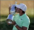  ?? CHRIS CARLSON — THE ASSOCIATED PRESS ?? Brooks Koepka kisses the winning trophy after the U.S. Open on June 18 at Erin Hills in Erin, Wis.