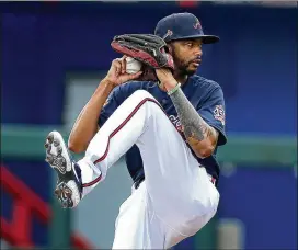  ?? PHOTOS BY CURTIS COMPTON/CURTIS.COMPTON@AJC.COM ?? Reliever Carl Edwards Jr. pitched a 1-2-3 fourth, capped by striking out Wander Franco, baseball’s top prospect. It was the Braves’ only clean inning. Edwards, a non-roster invitee, is competing for a spot in the bullpen.
