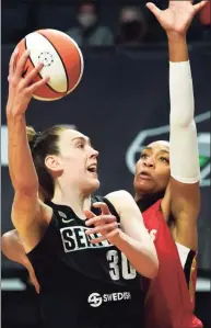  ?? Elaine Thompson / Associated Press ?? The Seattle Storm’s Breanna Stewart, left, shoots as the Las Vegas Aces’ A’ja Wilson defends in the second half in May.