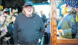  ??  ?? MICHAEL MOORE says he wants to “light a fire” in support of Hillary Clinton.