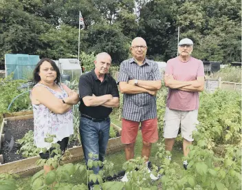  ??  ?? Sharon Phillips, Stan Glendennin­g, Stephen Martin and Charlie Horton at the allotments in Orton Malborne