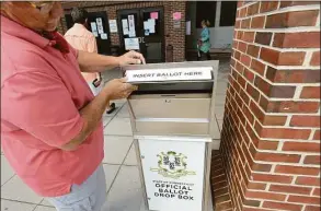  ?? Hearst Connecticu­t Media file photo ?? Metal boxes, bolted to sidewalks throughout the state, were purchased in 2020 using federal COVID-relief funding to make it easier for voters to cast absentee ballots.