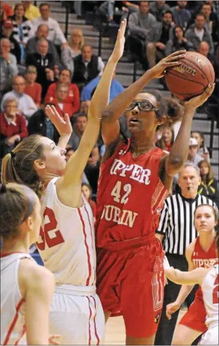  ?? GENE WALSH — DIGITAL FIRST MEDIA ?? Upper Dublin’s Jackie Vargas looks to shoot as Souderton’s Kate Connolly defends Monday night.