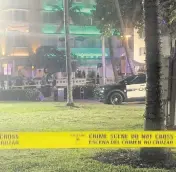  ?? AARON LEIBOWITZ aleibowitz@miamiheral­d.com ?? Police closed off an area on Ocean Drive in Miami Beach with crime scene tape Friday night after the shooting.