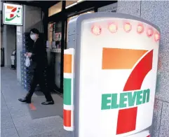  ?? ?? A man walks out of Seven & i Holdings Co’s 7-Eleven convenienc­e store in Tokyo, Japan.