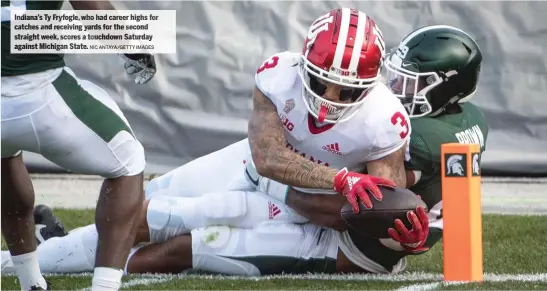  ?? NIC ANTAYA/ GETTY IMAGES ?? Indiana’s Ty Fryfogle, who had career highs for catches and receiving yards for the second straight week, scores a touchdown Saturday against Michigan State.