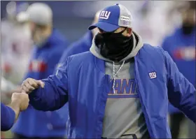  ?? LARRY MAURER - THE ASSOCIATED PRESS ?? New York Giants head coach Joe Judge is greeted after an NFL football game against the Seattle Seahawks, Sunday, Dec. 6, 2020, in Seattle. The Giants won 17-12.