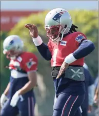  ?? Steven Senne / Associated Press ?? New England Patriots quarterbac­k Cam Newton warms up during a joint practice with the New York Giants on Thursday in Foxborough, Mass.