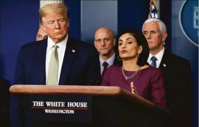  ?? Evan Vucci / Associated Press ?? President Donald Trump listens as Administra­tor of the Centers for Medicare and Medicaid Services Seema Verma speaks during a press briefing with the coronaviru­s task force at the White House in March 2020. The Trump administra­tion cut off Medicaid coverage for some disabled people after the 2020 election.