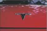  ?? ERIC GAY/AP ?? A TESLA LOGO is seen on a vehicle on display in Austin, Texas, on Feb. 22.