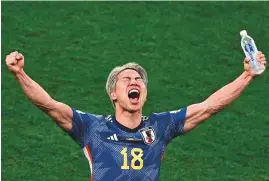  ?? ?? ■ Top: Japan striker Takuma Asano celebrates his team’s win against Germany yesterday.